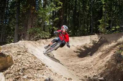 a person riding a dirt bike on a dirt road at Flying Dutchman 1210 in Keystone
