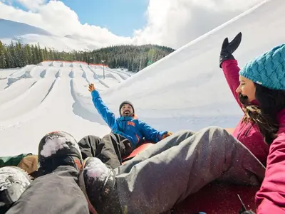 a group of people laying in the snow at Gateway 5070 in Keystone