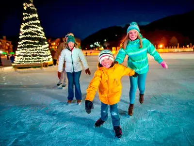 a group of people playing on an ice rink at Gateway 5070 in Keystone
