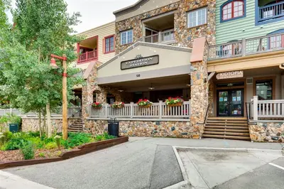 a building with a sign on the front of it at River Run Village 1 Bedroom Condo in Keystone