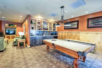 a large room with a pool table in it at River Run Village 2 Bedroom Condo - 100 Yards To Slopes, Pool, Hot Tub Access in Keystone