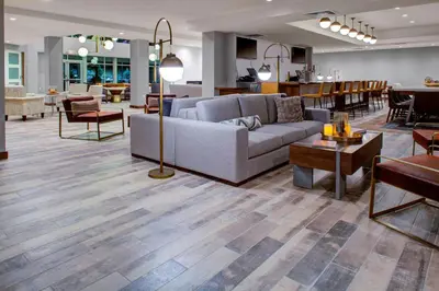 a living room with a couch and a table at Fairfield by Marriott Inn and Suites Boulder Broomfield Interlocken in Broomfield