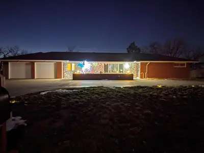 a house with christmas lights on the front of it at DIA BnB - Mountain View - Private floor - DIA Layover - Great entertainment and bed in Brighton