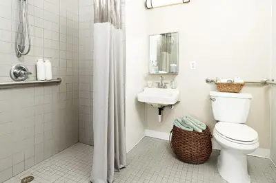 a bathroom with a toilet and a sink at InTown Suites Extended Stay Denver - Englewood in Englewood