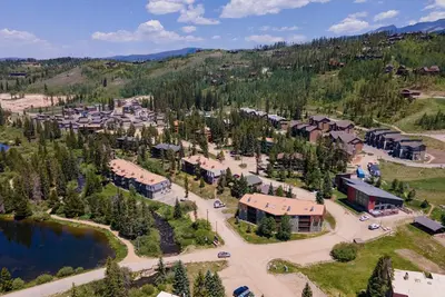 an aerial view of a resort with a lake at Hi Country Haus Unit 1515 in Winter Park