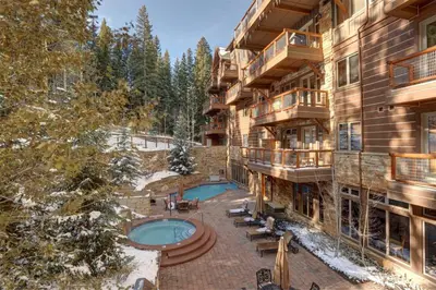an aerial view of an apartment building with a swimming pool at The Timbers Ski-In, Ski-Out 1 Bedroom Plus Murphy in Keystone