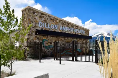 a building with a black gate in front of a mountain at Ski Run - Mountain House Keystone in Keystone