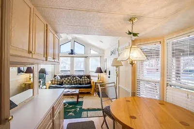 a kitchen and living room with a table and a couch at #84 in Breckenridge