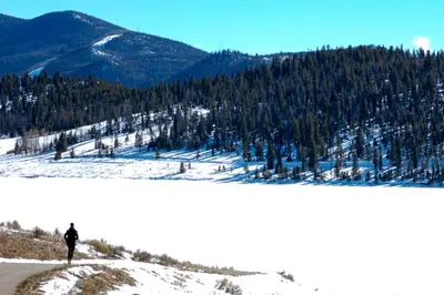 a person standing on top of a snow covered mountain at Timber Ridge #410 - Wildernest in Silverthorne