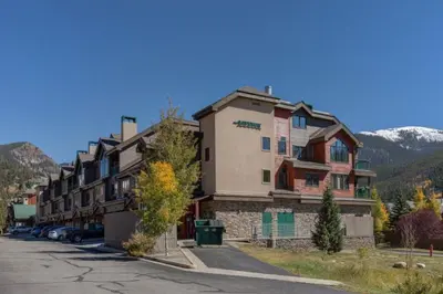 a large building on the side of a street at Studio Colorado Vacation Rental Located Near River Run Village With Hot Tub And Pool Access in Keystone