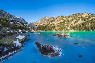 a view of a blue lake in the mountains at Lookout Mountain 27B Condo in Estes Park