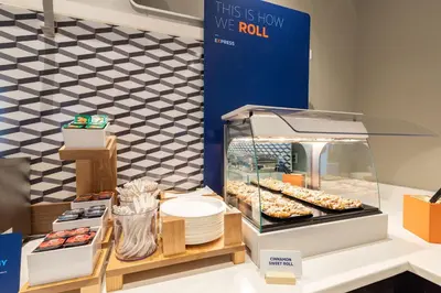 a display case with donuts and other pastries at Holiday Inn Express Denver Downtown by IHG in Denver