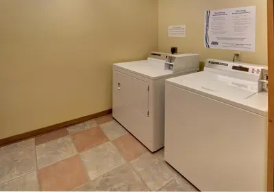 a small laundry room with a washer and dryer at Arapahoe Lodge 1 Bed 2 Bath ALJD in Keystone