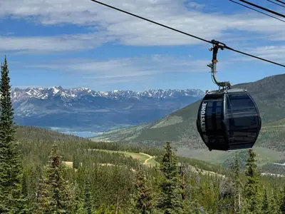 a gondola ride in a ski lift in the mountains at Saints John 2526 by SummitCove Lodging in Keystone