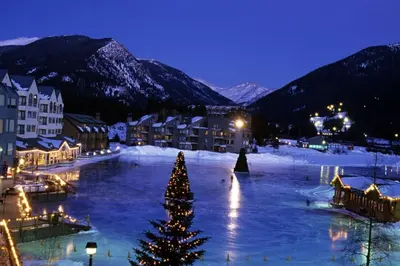 a christmas tree in the middle of a town at night at Private 2 Bedroom Townhome Located In East Keystone With Access To A Firepit, Hot Tub, And Billiards in Keystone