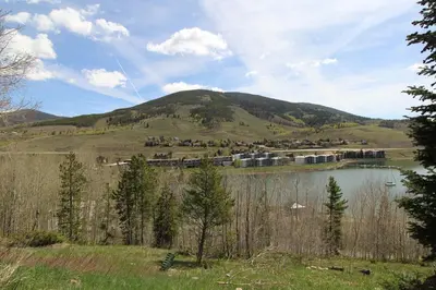 a view of a lake with a mountain in the background at CC42 Chateau Claire condo in Dillon