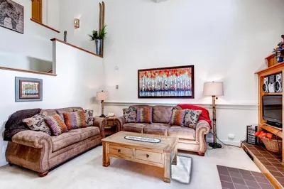 a living room with two couches and a coffee table at Hot Tub and Grilling Area Keystone Townhome! in Keystone