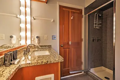 a bathroom with a sink and a shower at Hot Tub and Grilling Area Keystone Townhome! in Keystone
