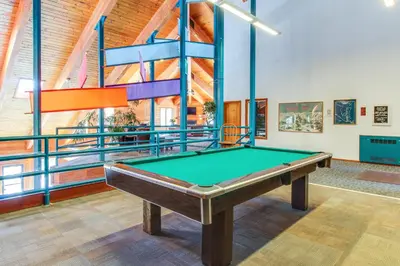 a pool table in a room with a ceiling at Timber Ridge Condo in Silverthorne