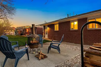 a patio with two chairs and a fire pit at Urban Oasis Near Old Town & PVH - Dog Friendly! in Fort Collins