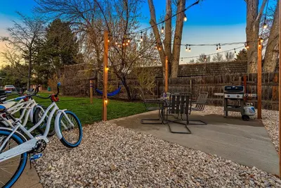a group of bikes parked in a yard with a grill at Couples Getaway - Dog Friendly, Bike to Old Town! in Fort Collins