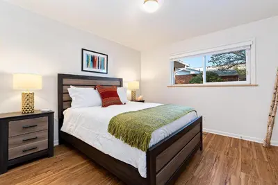 a bedroom with a bed and a window at Ultimate Chill Zone, BBQ, Bikes, Pet Friendly!! in Fort Collins