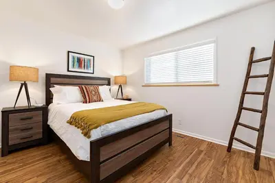 a bedroom with a bed and a ladder in it at Hidden Gem Near Old Town - Grill & Cruiser Bikes! in Fort Collins