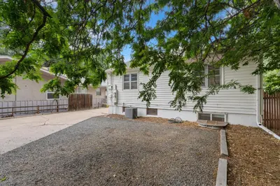 a house with a driveway in front of it at Charming Bungalow Next to CSU - Free Cruiser Bikes in Fort Collins