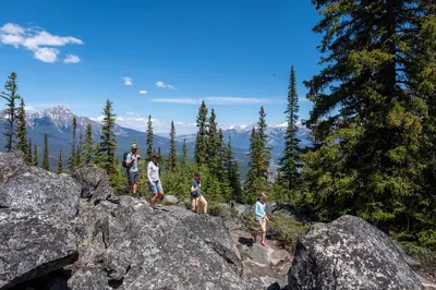 a group of people standing on top of some rocks at Alders 46 by SummitCove Lodging in Keystone