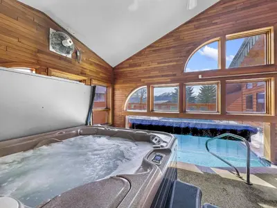 a large tub in a room with a fireplace at 75 Corinthian 3Br 3Ba Spacious Layout, Private Garage townhouse in Dillon