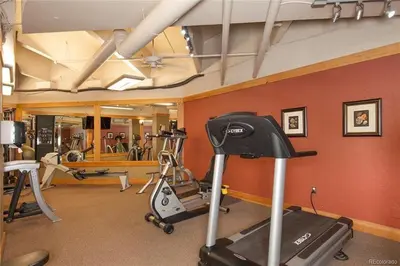 a gym with exercise bikes and a treadmill at 8176 Silver Mill condo in Keystone