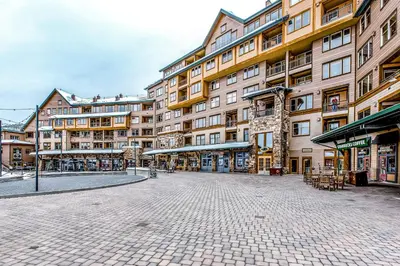 an empty street in front of a large building at Founders Pointe Condo in Winter Park