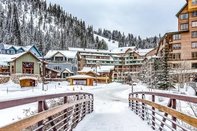 a town in the snow with a bridge at Founders Pointe Condo in Winter Park