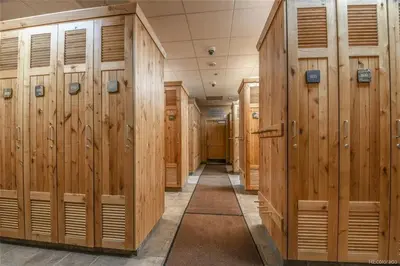 a row of wooden lockers in a locker room at 8282 Silver Mill condo in Keystone