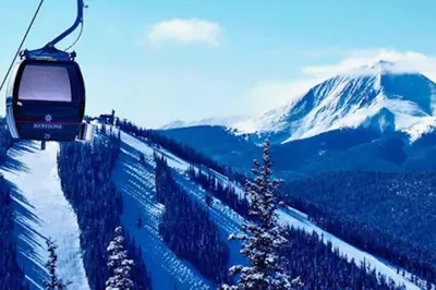 a ski lift going up a snow covered mountain at Lakeview A-303 - Dillon in Dillon