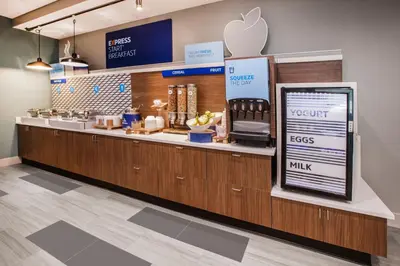 an apple store with a counter with an appleasteryasteryasteryasteryasteryasteryastery at Holiday Inn Express and Suites Denver East Peoria Street by IHG in Denver