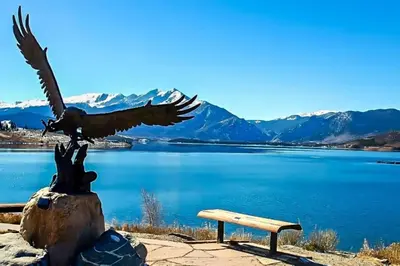 a statue of an eagle sitting next to a bench at Watch Hill #524 - Wildernest in Silverthorne