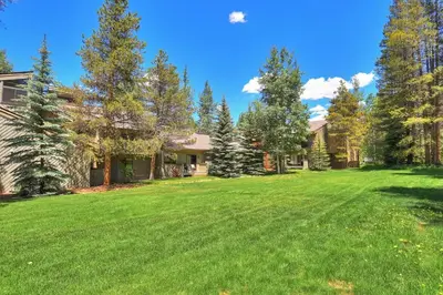 a large yard in front of a house at 1196 Flying Dutchman condo in Keystone