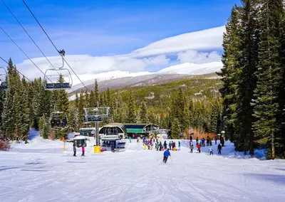a group of people on a ski slope with a ski lift at Cozens Pointe B-301 condo in Fraser