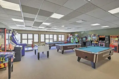 a play room with pool tables and arcade machines at 2 Mi to Skiing Studio with Pool Access in Granby! in Granby