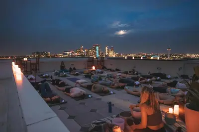 a group of people laying on the roof of a building at On Cloud 9 - Curated Lifestyle Loft - Zuni Lofts in Denver