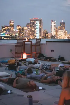 a group of people laying on the roof of a building at Fifty Shapes of Modern - Skyline Loft - Zuni Lofts in Denver