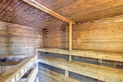 an empty wooden sauna with wooden benches in it at Granby Studio with Mtn Views Near Hiking and Skiing! in Granby