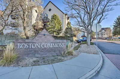 a sign for aitution conventions in front of a street at Condo with Patio and Pool Access in Greenwood Village! in Greenwood Village