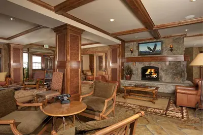 a living room filled with furniture and a fireplace at Luxurious 1 BR in River Run Village with Ski in ski out condo in Dillon