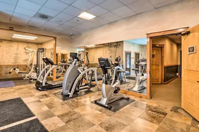 a gym with treadmills and elliptical machines at Ski-Out Keystone Resort Condo with Private Balcony in Keystone