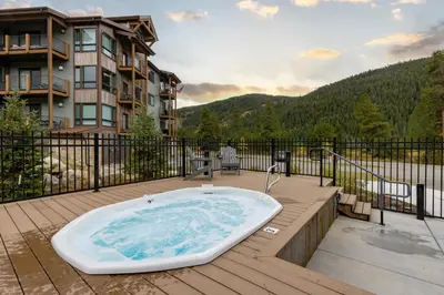 a bath tub sitting on top of a deck at 202 Clearwater Lofts condo in Keystone