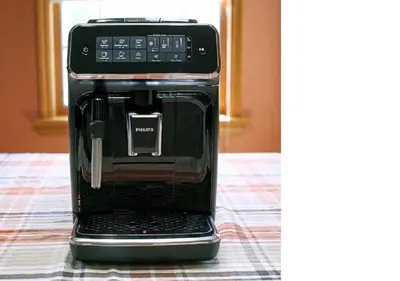 a black coffee maker is sitting on a table at Mummy Mtn Suite 1 Bedroom suite with fireplace and jacuzzi tub in Estes Park