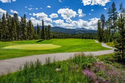 a golf course with a road leading to a green at North Keystone 3 Bedroom Near Conference Center in Keystone