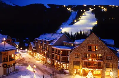 a ski lodge in a town with a ski slope at night at 2 Bedroom Condo In Keystone - West Keystone in Keystone